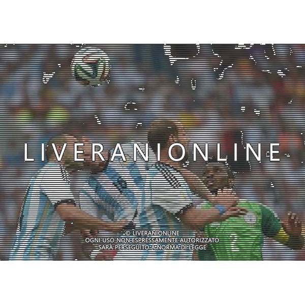 (140625) -- PORTO ALEGRE, June 25, 2014 () -- Nigeria\'s Joseph Yobo (1st R) competes with Argentina\'s players during a Group F match between Nigeria and Argentina of 2014 FIFA World Cup at the Estadio Beira-Rio Stadium in Porto Alegre, Brazil, on June 25, 2014.(/Li Ga)(pcy) AG ALDO LIVERANI SAS ONLY ITALY