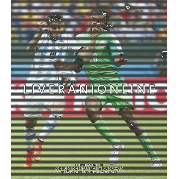 (140625) -- PORTO ALEGRE, June 25, 2014 () -- Argentina\'s Ricardo Alvarez (L) vies with Nigeria\'s Michael Uchebo during a Group F match between Nigeria and Argentina of 2014 FIFA World Cup at the Estadio Beira-Rio Stadium in Porto Alegre, Brazil, on June 25, 2014. Argentina won 3-2 over Nigeria on Wednesday. (/Chen Jianli)(pcy) AG ALDO LIVERANI SAS ONLY ITALY