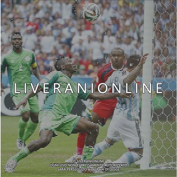 (140625) -- PORTO ALEGRE, June 25, 2014 () -- Nigeria\'s Kenneth Omeruo (2nd L) attempts to block the ball during a Group F match between Nigeria and Argentina of 2014 FIFA World Cup at the Estadio Beira-Rio Stadium in Porto Alegre, Brazil, on June 25, 2014. Argentina won 3-2 over Nigeria on Wednesday. (/Chen Jianli)(pcy) AG ALDO LIVERANI SAS ONLY ITALY