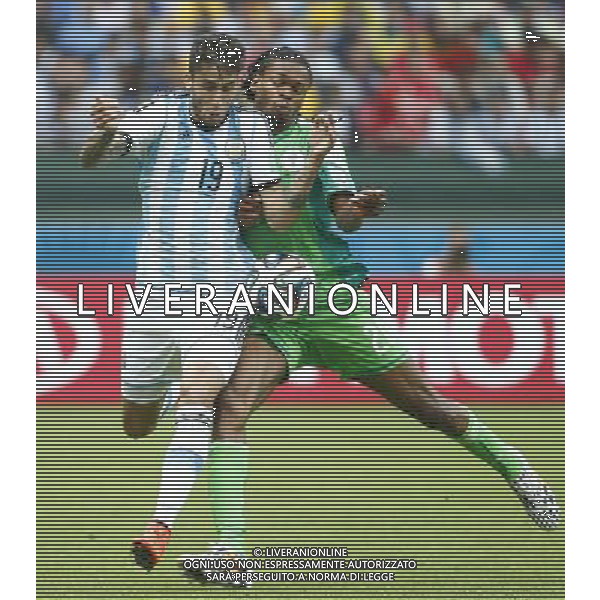 (140625) -- PORTO ALEGRE, June 25, 2014 () -- Argentina\'s Ricardo Alvarez (L) vies with Nigeria\'s Michael Uchebo during a Group F match between Nigeria and Argentina of 2014 FIFA World Cup at the Estadio Beira-Rio Stadium in Porto Alegre, Brazil, on June 25, 2014. Argentina won 3-2 over Nigeria on Wednesday. (/Chen Jianli)(pcy) AG ALDO LIVERANI SAS ONLY ITALY