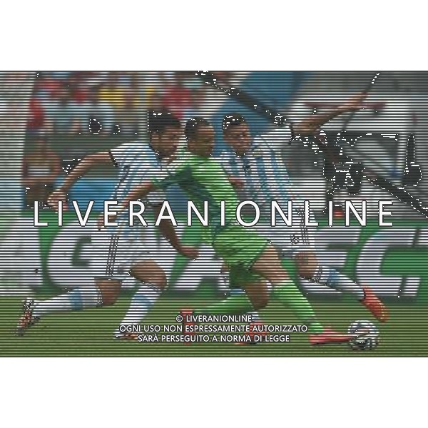 (140625) -- PORTO ALEGRE, June 25, 2014 () -- Nigeria\'s Peter Osaze Odemwingie (C) competes with Argentina\'s Ezequiel Garay (L) and Marcos Rojo during a Group F match between Nigeria and Argentina of 2014 FIFA World Cup at the Estadio Beira-Rio Stadium in Porto Alegre, Brazil, on June 25, 2014. Argentina won 3-2 over Nigeria on Wednesday. (/Li Ga)(pcy) AG ALDO LIVERANI SAS ONLY ITALY