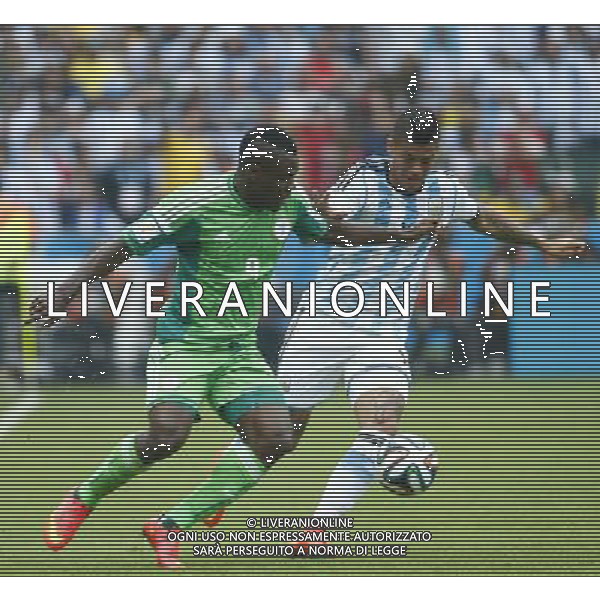 (140625) -- PORTO ALEGRE, June 25, 2014 () -- Nigeria\'s Emmanuel Emenike (L) vies with Argentina\'s Marcos Rojo during a Group F match between Nigeria and Argentina of 2014 FIFA World Cup at the Estadio Beira-Rio Stadium in Porto Alegre, Brazil, on June 25, 2014. Argentina won 3-2 over Nigeria on Wednesday. (/Chen Jianli)(pcy) AG ALDO LIVERANI SAS ONLY ITALY