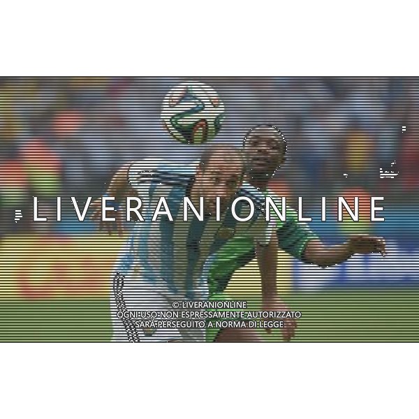(140625) -- PORTO ALEGRE, June 25, 2014 () -- Argentina\'s Pablo Zabaleta (front) competes for a header during a Group F match between Nigeria and Argentina of 2014 FIFA World Cup at the Estadio Beira-Rio Stadium in Porto Alegre, Brazil, on June 25, 2014. Argentina won 3-2 over Nigeria on Wednesday. (/Li Ga)(pcy) AG ALDO LIVERANI SAS ONLY ITALY