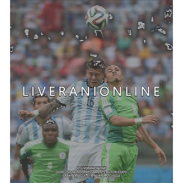 (140625) -- PORTO ALEGRE, June 25, 2014 () -- Argentina\'s Marcos Rojo (2nd R) competes for a header with Nigeria\'s Peter Osaze Odemwingie (1st R)during a Group F match between Nigeria and Argentina of 2014 FIFA World Cup at the Estadio Beira-Rio Stadium in Porto Alegre, Brazil, on June 25, 2014. Argentina won 3-2 over Nigeria on Wednesday. (/Li Ga)(pcy) AG ALDO LIVERANI SAS ONLY ITALY