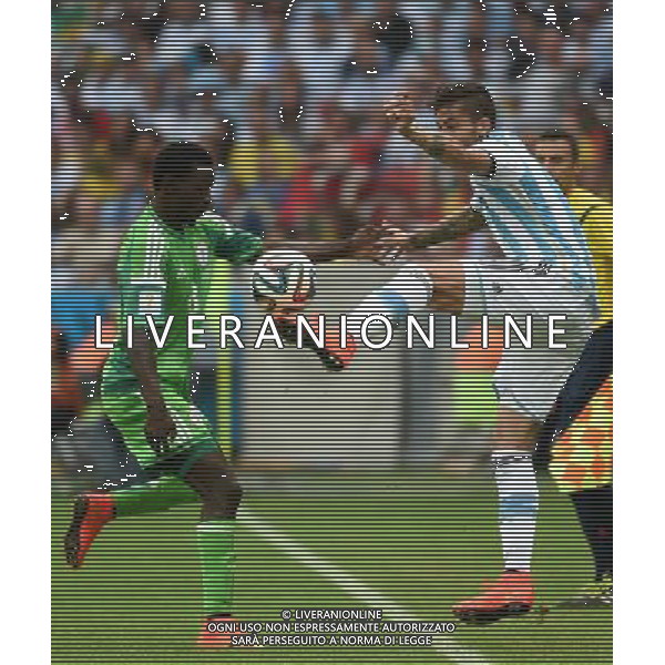 (140625) -- PORTO ALEGRE, June 25, 2014 () -- Nigeria\'s Babatunde Michael (L) competes with Argentina\'s Marcos Rojo during a Group F match between Nigeria and Argentina of 2014 FIFA World Cup at the Estadio Beira-Rio Stadium in Porto Alegre, Brazil, on June 25, 2014. Argentina won 3-2 over Nigeria on Wednesday. (/Li Ga)(pcy) AG ALDO LIVERANI SAS ONLY ITALY