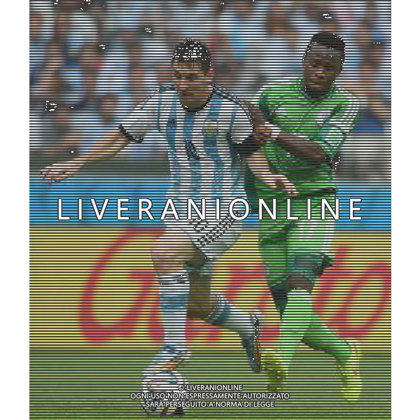 (140625) -- PORTO ALEGRE, June 25, 2014 () -- Argentina\'s Lionel Messi (L) vies with Nigeria\'s Ogenyi Onazi during a Group F match between Nigeria and Argentina of 2014 FIFA World Cup at the Estadio Beira-Rio Stadium in Porto Alegre, Brazil, on June 25, 2014. Argentina won 3-2 over Nigeria on Wednesday. (/Li Ga)(pcy) AG ALDO LIVERANI SAS ONLY ITALY