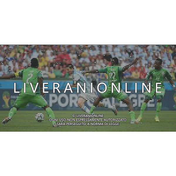 (140625) -- PORTO ALEGRE, June 25, 2014 () -- Argentina\'s Lionel Messi (2nd L) breaks through during a Group F match between Nigeria and Argentina of 2014 FIFA World Cup at the Estadio Beira-Rio Stadium in Porto Alegre, Brazil, on June 25, 2014. Argentina won 3-2 over Nigeria on Wednesday. (/Li Ga)(pcy) AG ALDO LIVERANI SAS ONLY ITALY