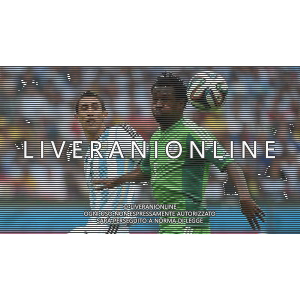 (140625) -- PORTO ALEGRE, June 25, 2014 () -- Argentina\'s Angel Di Maria (L) vies with Nigeria\'s Efe Ambrose during a Group F match between Nigeria and Argentina of 2014 FIFA World Cup at the Estadio Beira-Rio Stadium in Porto Alegre, Brazil, on June 25, 2014. Argentina won 3-2 over Nigeria on Wednesday. (/Li Ga)(pcy) AG ALDO LIVERANI SAS ONLY ITALY