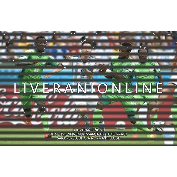 (140625) -- PORTO ALEGRE, June 25, 2014 () -- Argentina\'s Lionel Messi (2nd L) breaks through during a Group F match between Nigeria and Argentina of 2014 FIFA World Cup at the Estadio Beira-Rio Stadium in Porto Alegre, Brazil, on June 25, 2014. Argentina won 3-2 over Nigeria on Wednesday. (/Li Ga)(pcy) AG ALDO LIVERANI SAS ONLY ITALY