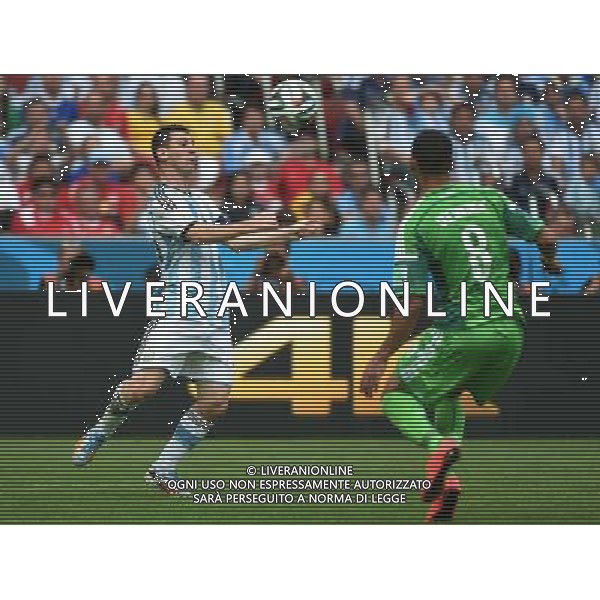 (140625) -- PORTO ALEGRE, June 25, 2014 () -- Argentina\'s Lionel Messi (L) controls the ball during a Group F match between Nigeria and Argentina of 2014 FIFA World Cup at the Estadio Beira-Rio Stadium in Porto Alegre, Brazil, on June 25, 2014. Argentina won 3-2 over Nigeria on Wednesday. (/Li Ga)(pcy) AG ALDO LIVERANI SAS ONLY ITALY