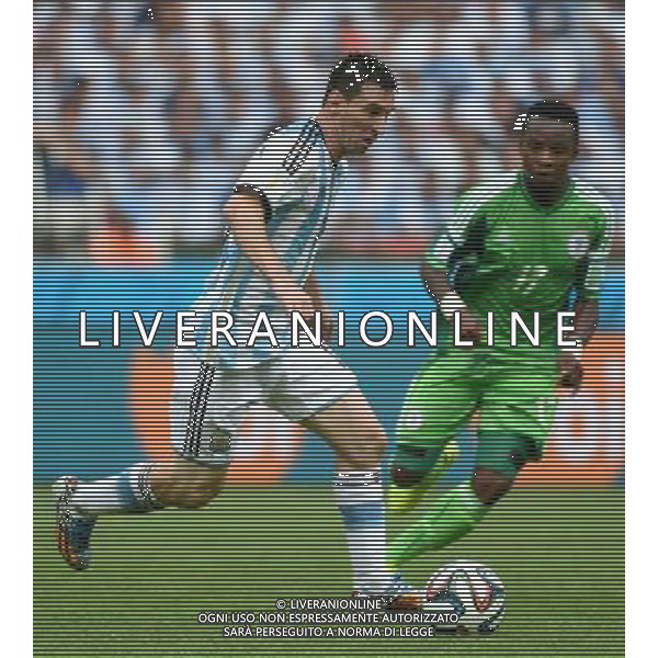 (140625) -- PORTO ALEGRE, June 25, 2014 () -- Argentina\'s Lionel Messi (L) runs with the ball during a Group F match between Nigeria and Argentina of 2014 FIFA World Cup at the Estadio Beira-Rio Stadium in Porto Alegre, Brazil, on June 25, 2014. Argentina won 3-2 over Nigeria on Wednesday. (/Li Ga)(pcy) AG ALDO LIVERANI SAS ONLY ITALY