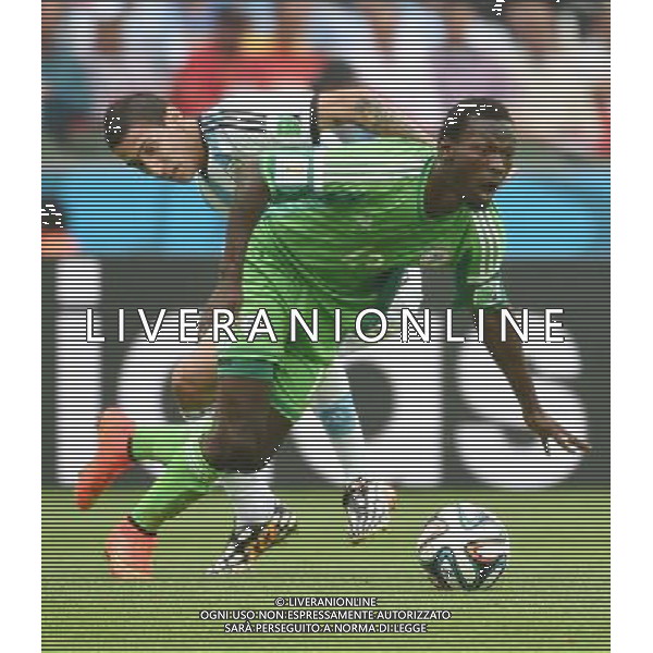(140625) -- PORTO ALEGRE, June 25, 2014 () -- Argentina\'s Angel Di Maria (L) vies with Nigeria\'s Juwon Oshaniwa during a Group F match between Nigeria and Argentina of 2014 FIFA World Cup at the Estadio Beira-Rio Stadium in Porto Alegre, Brazil, on June 25, 2014. Argentina won 3-2 over Nigeria on Wednesday. (/Li Ga)(pcy) AG ALDO LIVERANI SAS ONLY ITALY