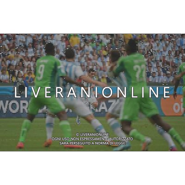 (140625) -- PORTO ALEGRE, June 25, 2014 () -- Argentina\'s Lionel Messi (back) shoots a free kick during a Group F match between Nigeria and Argentina of 2014 FIFA World Cup at the Estadio Beira-Rio Stadium in Porto Alegre, Brazil, on June 25, 2014. Argentina won 3-2 over Nigeria on Wednesday. (/Li Ga)(pcy) AG ALDO LIVERANI SAS ONLY ITALY