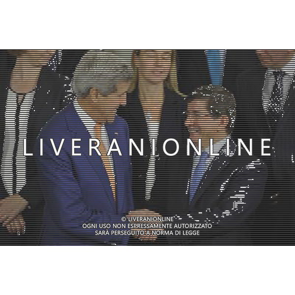(140625) -- BRUSSELS, June 25, 2014 () -- US Secretary of State John Kerry (L) talks with Turkish Foreign Minister Ahmet Davutoglu during the family photo session of NATO Foreign Ministers Meetings at its headquarters in Brussels, capital of Brussels, June 25, 2014. (/Ye Pingfan) ©PHOTOSHOT/Agenzia Aldo Liverani sas - ITALY ONLY - EDITORIAL USE ONLY - Riunione dei Ministri degli esteri della NATO presso la sede di Bruxelles, Belgio 25 giugno 2014