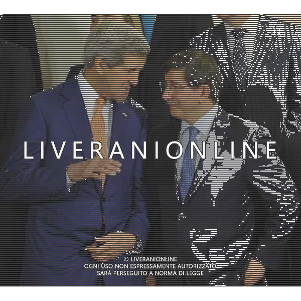 (140625) -- BRUSSELS, June 25, 2014 () -- US Secretary of State John Kerry (L) talks with Turkish Foreign Minister Ahmet Davutoglu during the family photo session of NATO Foreign Ministers Meetings at its headquarters in Brussels, capital of Brussels, June 25, 2014. (/Ye Pingfan) ©PHOTOSHOT/Agenzia Aldo Liverani sas - ITALY ONLY - EDITORIAL USE ONLY - Riunione dei Ministri degli esteri della NATO presso la sede di Bruxelles, Belgio 25 giugno 2014