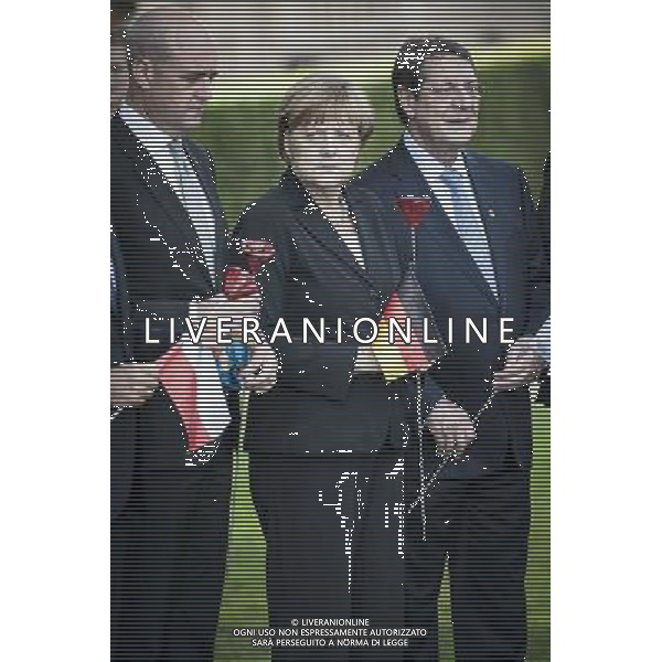 (L-R) Swedish Prime Minister Fredrik Reinfeldt, German Chancellor Angela Merkel, Cypriot President Nicos Anastasiades attend a ceremony marking the centenary of the outbreak of World War I, in Ypres, Belgium on 26.06.2014 During the war, hundreds of thousands of soldiers and civilians from all over the world lost their lives around the Belgian town of Ypres. To mark the occasion, the European Union donated a symbolic bench with bronzed copper plates reading the word \'Peace\' in the EU\'s 24 official languages. by Wiktor Dabkowski ©PHOTOHOT/Agenzia Aldo Liverani sas - ITALY ONLY - EDITORIAL USE ONLY