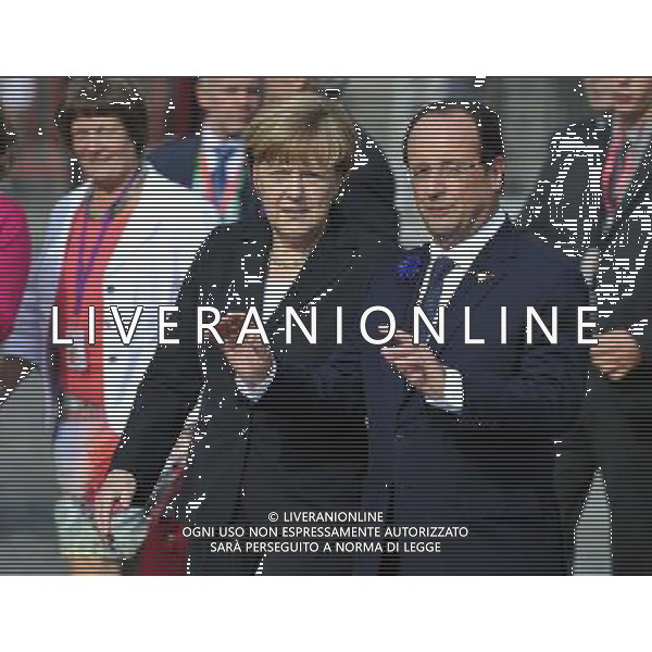 (140626) -- BRUSSELS, June 26, 2014 () -- German Chancellor Angela Merkel (L) talks with French President Francois Hollande after a ceremony marking the centenary of the outbreak of World War I, in Ypres, northwest of Belgium, on June 26, 2014. During the war, hundreds of thousands of soldiers and civilians from all over the world lost their lives around the Belgian town of Ypres. EU leaders begin a two-day summit here, one of the World War I\'s deadliest battlefields, on Thursday. (/Ye Pingfan) ©PHOTOHOT/Agenzia Aldo Liverani sas - ITALY ONLY - EDITORIAL USE ONLY