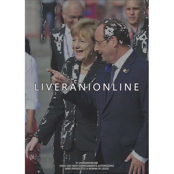 (140626) -- BRUSSELS, June 26, 2014 () -- German Chancellor Angela Merkel (L) talks with French President Francois Hollande after a ceremony marking the centenary of the outbreak of World War I, in Ypres, northwest of Belgium, on June 26, 2014. During the war, hundreds of thousands of soldiers and civilians from all over the world lost their lives around the Belgian town of Ypres. EU leaders begin a two-day summit here, one of the World War I\'s deadliest battlefields, on Thursday. (/Ye Pingfan) ©PHOTOHOT/Agenzia Aldo Liverani sas - ITALY ONLY - EDITORIAL USE ONLY