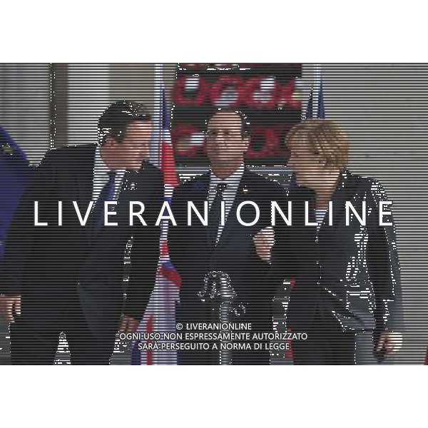(140626) -- BRUSSELS, June 26, 2014 () -- British Prime Minister David Cameron, French President Francois Hollande, German Chancellor Angela Merkel (from L to R) attend a ceremony marking the centenary of the outbreak of World War I, in Ypres, northwest of Belgium, on June 26, 2014. During the war, hundreds of thousands of soldiers and civilians from all over the world lost their lives around the Belgian town of Ypres. EU leaders begin a two-day summit here, one of the World War I\'s deadliest battlefields, on Thursday. (/Ye Pingfan) ©PHOTOHOT/Agenzia Aldo Liverani sas - ITALY ONLY - EDITORIAL USE ONLY