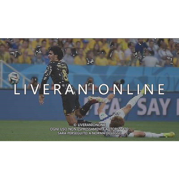 (140626) -- SAO PAULO, June 26, 2014 () -- Belgium\'s Marouane Fellaini (L) competes with Korea Republic\'s Ki Sung Yueng during a Group H match between Korea Republic and Belgium of 2014 FIFA World Cup at the Arena de Sao Paulo Stadium in Sao Paulo, Brazil, on June 26, 2014. (/Li Ga)(xzj) ©PHOTOHOT/Agenzia Aldo Liverani sas - ITALY ONLY - EDITORIAL USE ONLY