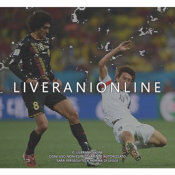 (140626) -- SAO PAULO, June 26, 2014 () -- Korea Republic\'s Koo Ja Cheol competes with Belgium\'s Marouane Fellaini during a Group H match between Korea Republic and Belgium of 2014 FIFA World Cup at the Arena de Sao Paulo Stadium in Sao Paulo, Brazil, on June 26, 2014. (/Li Ga)(xzj) ©PHOTOHOT/Agenzia Aldo Liverani sas - ITALY ONLY - EDITORIAL USE ONLY