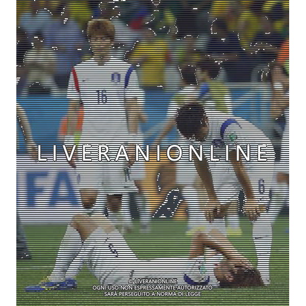 (140626) -- SAO PAULO, June 26, 2014 () -- Korea Republic\'s Kim Young Gwon (bottom) reacts after a Group H match between Korea Republic and Belgium of 2014 FIFA World Cup at the Arena de Sao Paulo Stadium in Sao Paulo, Brazil, on June 26, 2014. Belgium won 1-0 over Korea Republic on Thursday. Belgium and Algeria enter Round of 16 from Group H. (/Chen Jianli)(pcy) ©PHOTOHOT/Agenzia Aldo Liverani sas - ITALY ONLY - EDITORIAL USE ONLY