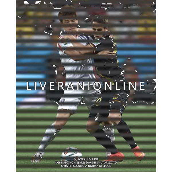 (140626) -- SAO PAULO, June 26, 2014 () -- Belgium\'s Adnan Januzaj (R) competes with Korea Republic\'s Yun Suk Young during a Group H match between Korea Republic and Belgium of 2014 FIFA World Cup at the Arena de Sao Paulo Stadium in Sao Paulo, Brazil, on June 26, 2014. (/Li Ga)(xzj) ©PHOTOHOT/Agenzia Aldo Liverani sas - ITALY ONLY - EDITORIAL USE ONLY