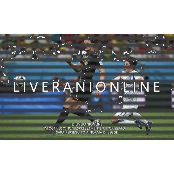 (140626) -- SAO PAULO, June 26, 2014 () -- Korea Republic\'s Lee Keun Ho (R) vies with Belgium\'s Daniel Van Buyten during a Group H match between Korea Republic and Belgium of 2014 FIFA World Cup at the Arena de Sao Paulo Stadium in Sao Paulo, Brazil, on June 26, 2014. Belgium won 1-0 over Korea Republic on Thursday. Belgium and Algeria enter Round of 16 from Group H. (/Li Ga)(pcy) ©PHOTOHOT/Agenzia Aldo Liverani sas - ITALY ONLY - EDITORIAL USE ONLY
