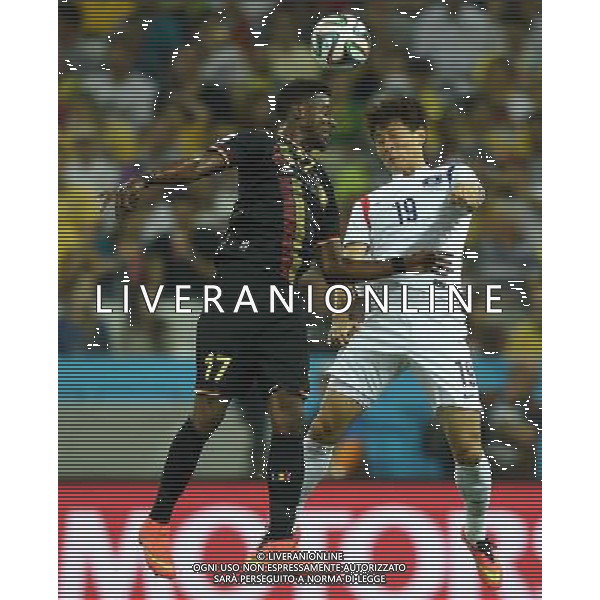 (140626) -- SAO PAULO, June 26, 2014 () -- Korea Republic\'s Ji Dong Won (R) vies with Belgium\'s Divock Origi during a Group H match between Korea Republic and Belgium of 2014 FIFA World Cup at the Arena de Sao Paulo Stadium in Sao Paulo, Brazil, on June 26, 2014. Belgium won 1-0 over Korea Republic on Thursday. Belgium and Algeria enter Round of 16 from Group H. (/Li Ga)(pcy) ©PHOTOHOT/Agenzia Aldo Liverani sas - ITALY ONLY - EDITORIAL USE ONLY