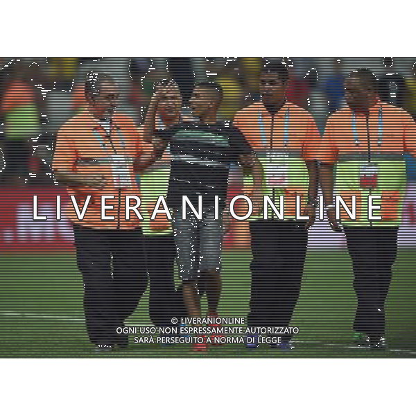 (140626) -- SAO PAULO, June 26, 2014 () -- A football fan who runs into the field is dragged out by securities after a Group H match between Korea Republic and Belgium of 2014 FIFA World Cup at the Arena de Sao Paulo Stadium in Sao Paulo, Brazil, on June 26, 2014. Belgium won 1-0 over Korea Republic on Thursday. Belgium and Algeria enter Round of 16 from Group H. (/Li Ga)(pcy) ©PHOTOHOT/Agenzia Aldo Liverani sas - ITALY ONLY - EDITORIAL USE ONLY