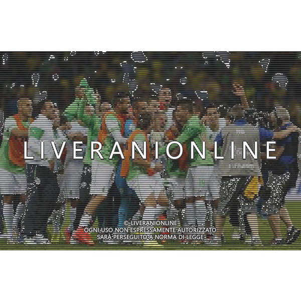 (140626) -- CURITIBA, June 26, 2014 () -- Algeria\'s players celebrate after a Group H match between Algeria and Russia of 2014 FIFA World Cup at the Arena da Baixada Stadium in Curitiba, Brazil, June 26, 2014. Algeria enters Round of 16 after the Thursday match which ended in a 1-1 draw.(/Zhou Lei) ©PHOTOHOT/Agenzia Aldo Liverani sas - ITALY ONLY - EDITORIAL USE ONLY