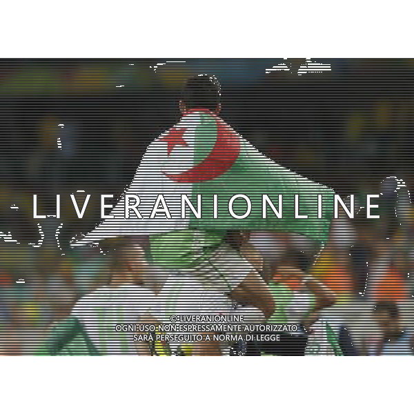 (140626) -- CURITIBA, June 26, 2014 () -- Algeria\'s players celebrate after a Group H match between Algeria and Russia of 2014 FIFA World Cup at the Arena da Baixada Stadium in Curitiba, Brazil, June 26, 2014. Algeria enters Round of 16 after the Thursday match which ended in a 1-1 draw.(/Zhou Lei) ©PHOTOHOT/Agenzia Aldo Liverani sas - ITALY ONLY - EDITORIAL USE ONLY