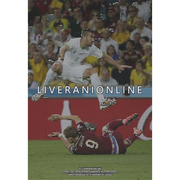(140626) -- CURITIBA, June 26, 2014 () -- Algeria\'s Essaid Belkalem vies with Russia\'s Aleksandr Kokorin during a Group H match between Algeria and Russia of 2014 FIFA World Cup at the Arena da Baixada Stadium in Curitiba, Brazil, June 26, 2014. The match ended in a 1-1 draw.Algeria enters Round of 16 after the Thursday match which ended in a 1-1 draw.(/Liao Yujie) ©PHOTOHOT/Agenzia Aldo Liverani sas - ITALY ONLY - EDITORIAL USE ONLY