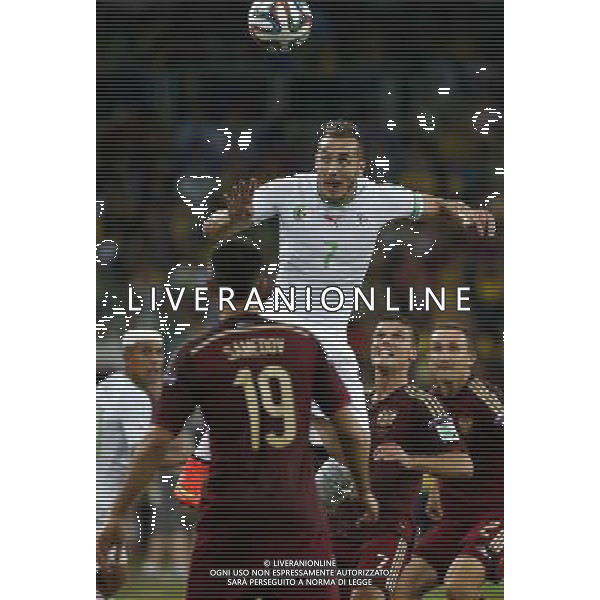 (140626) -- CURITIBA, June 26, 2014 () -- Algeria\'s Hassan Yebda (up) competes for a header during a Group H match between Algeria and Russia of 2014 FIFA World Cup at the Arena da Baixada Stadium in Curitiba, Brazil, June 26, 2014. The match ended in a 1-1 draw.Algeria enters Round of 16 after the Thursday match which ended in a 1-1 draw.(/Liao Yujie) ©PHOTOHOT/Agenzia Aldo Liverani sas - ITALY ONLY - EDITORIAL USE ONLY