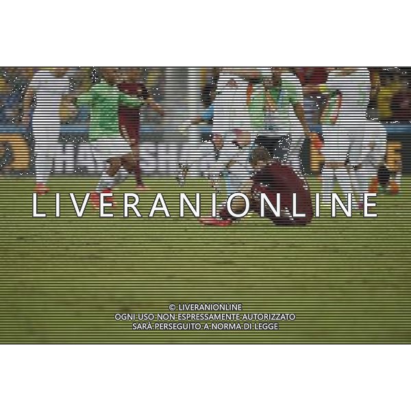 (140626) -- CURITIBA, June 26, 2014 () -- Russia\'s Aleksandr Kokorin (down) reacts after a Group H match between Algeria and Russia of 2014 FIFA World Cup at the Arena da Baixada Stadium in Curitiba, Brazil, June 26, 2014. The match ended in a 1-1 draw.Algeria enters Round of 16 after the Thursday match which ended in a 1-1 draw.(/Liao Yujie) ©PHOTOHOT/Agenzia Aldo Liverani sas - ITALY ONLY - EDITORIAL USE ONLY