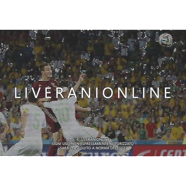 (140626) -- CURITIBA, June 26, 2014 () -- Russia\'s Aleksey Kozlov (up) jumps for a header during a Group H match between Algeria and Russia of 2014 FIFA World Cup at the Arena da Baixada Stadium in Curitiba, Brazil, June 26, 2014. The match ended in a 1-1 draw.Algeria enters Round of 16 after the Thursday match which ended in a 1-1 draw.(/Liao Yujie) ©PHOTOHOT/Agenzia Aldo Liverani sas - ITALY ONLY - EDITORIAL USE ONLY