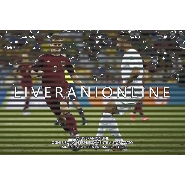 (140626) -- CURITIBA, June 26, 2014 () -- Algeria\'s Essaid Belkalem vies with Russia\'s Aleksandr Kokorin during a Group H match between Algeria and Russia of 2014 FIFA World Cup at the Arena da Baixada Stadium in Curitiba, Brazil, June 26, 2014. (/Liao Yujie) ©PHOTOHOT/Agenzia Aldo Liverani sas - ITALY ONLY - EDITORIAL USE ONLY
