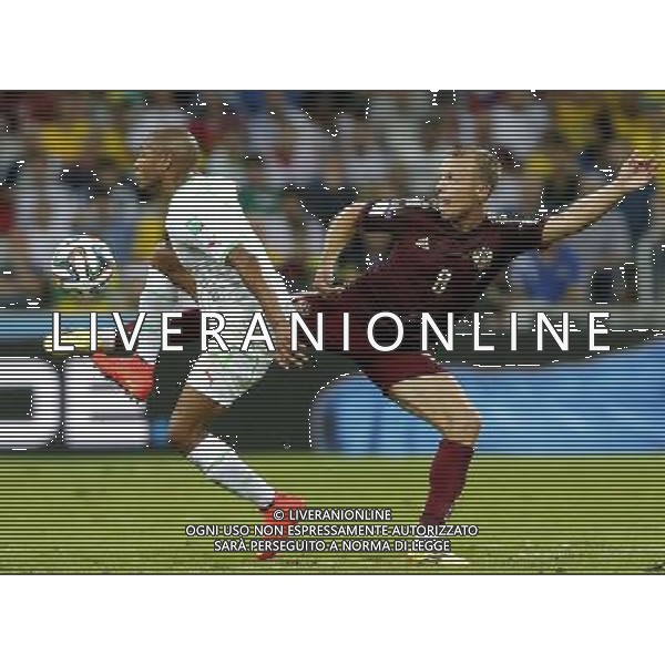 (140626) -- CURITIBA, June 26, 2014 () -- Algeria\'s Yasine Brahimi vies with Russia\'s Denis Glushakov during a Group H match between Algeria and Russia of 2014 FIFA World Cup at the Arena da Baixada Stadium in Curitiba, Brazil, June 26, 2014. (/Zhou Lei) ©PHOTOHOT/Agenzia Aldo Liverani sas - ITALY ONLY - EDITORIAL USE ONLY