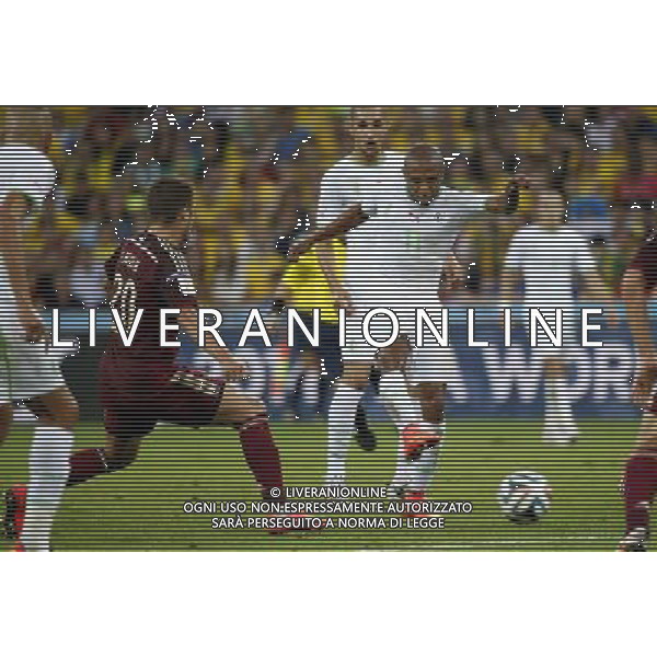 (140626) -- CURITIBA, June 26, 2014 () -- Algeria\'s Yasine Brahimi (R) passes the ball during a Group H match between Algeria and Russia of 2014 FIFA World Cup at the Arena da Baixada Stadium in Curitiba, Brazil, June 26, 2014. (/Liao Yujie) ©PHOTOHOT/Agenzia Aldo Liverani sas - ITALY ONLY - EDITORIAL USE ONLY