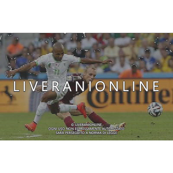 (140626) -- CURITIBA, June 26, 2014 () -- Algeria\'s Yasine Brahimi vies with Russia\'s Denis Glushakov during a Group H match between Algeria and Russia of 2014 FIFA World Cup at the Arena da Baixada Stadium in Curitiba, Brazil, June 26, 2014. (/Zhou Lei) ©PHOTOHOT/Agenzia Aldo Liverani sas - ITALY ONLY - EDITORIAL USE ONLY