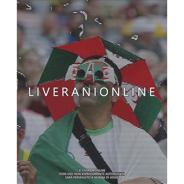 (140626) -- CURITIBA, June 26, 2014 () -- An Algeria\'s fan waits for a Group H match between Algeria and Russia of 2014 FIFA World Cup at the Arena da Baixada Stadium in Curitiba, Brazil, June 26, 2014. (/Zhou Lei) ©PHOTOHOT/Agenzia Aldo Liverani sas - ITALY ONLY - EDITORIAL USE ONLY