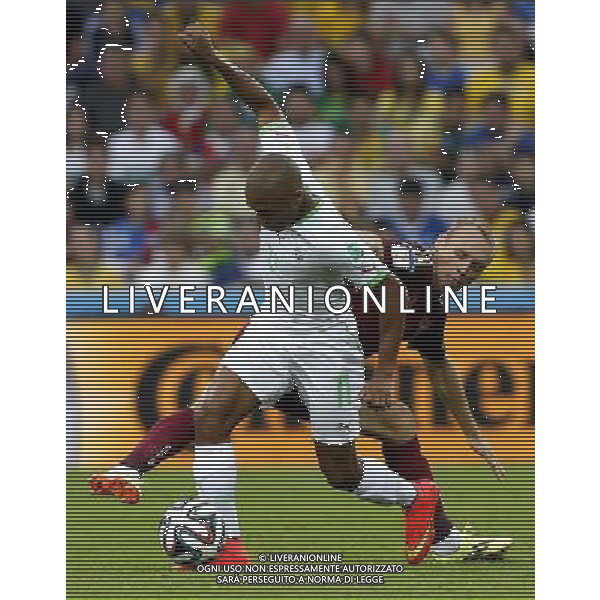 (140626) -- CURITIBA, June 26, 2014 () -- Algeria\'s Yasine Brahimi vies with Russia\'s Denis Glushakov during a Group H match between Algeria and Russia of 2014 FIFA World Cup at the Arena da Baixada Stadium in Curitiba, Brazil, June 26, 2014. (/Zhou Lei) ©PHOTOHOT/Agenzia Aldo Liverani sas - ITALY ONLY - EDITORIAL USE ONLY