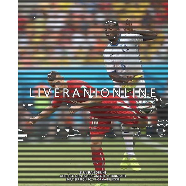 (140625) -- MANAUS, June 25, 2014 () -- Switzerland\'s Granit Xhaka (L) vies with Honduras\' Juan Carlos Garcia during a Group E match between Honduras and Switzerland of 2014 FIFA World Cup at the Arena Amazonia Stadium in Manaus, Brazil, on June 25, 2014. Switzerland won 3-0 over Honduras on Wednesday. (/Li Ming)(pcy) ©PHOTOSHOT/Agenzia Aldo Liverani sas - ITALY ONLY - EDITORIAL USE ONLY
