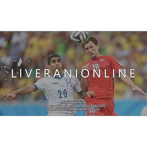 (140625) -- MANAUS, June 25, 2014 () -- Switzerland\'s Admir Mehmedi (R) competes for a header with Honduras\' Jorge Claros during a Group E match between Honduras and Switzerland of 2014 FIFA World Cup at the Arena Amazonia Stadium in Manaus, Brazil, on June 25, 2014.(/Liu Dawei)(pcy) ©PHOTOSHOT/Agenzia Aldo Liverani sas - ITALY ONLY - EDITORIAL USE ONLY