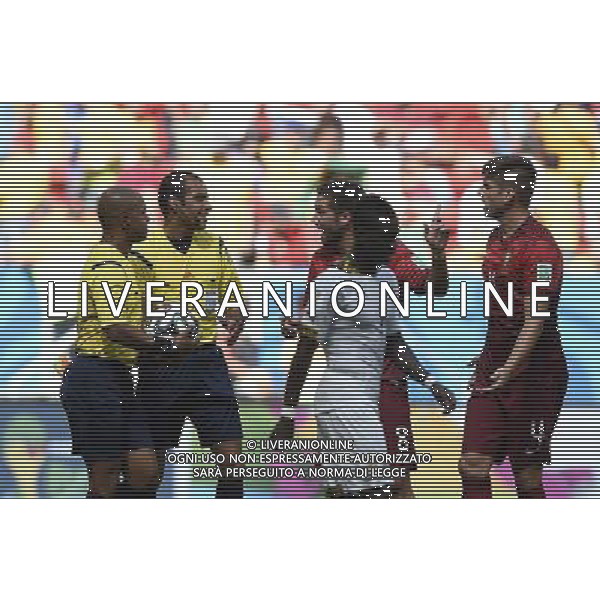 (140626) -- BRASILIA, June 26, 2014 () -- Portugal\'s Joao Moutinho (2nd L, back) argues with referees during a Group G match between Portugal and Ghana of 2014 FIFA World Cup at the Estadio Nacional Stadium in Brasilia, Brazil, June 26, 2014. (/Qi Heng)(xzj) ©PHOTOHOT/Agenzia Aldo Liverani sas - ITALY ONLY - EDITORIAL USE ONLY