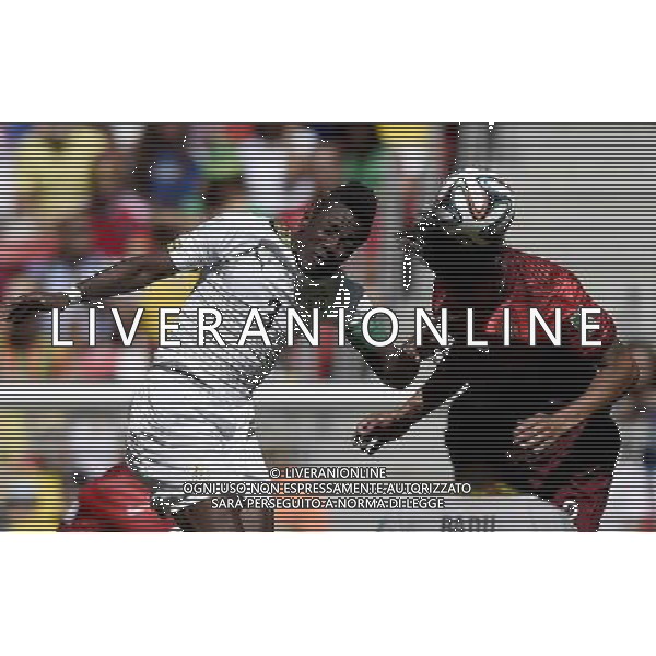 (140626) -- BRASILIA, June 26, 2014 () -- Ghana\'s Asamoah Gyan (L) competes for a header with Portugal\'s Bruno Alves during a Group G match between Portugal and Ghana of 2014 FIFA World Cup at the Estadio Nacional Stadium in Brasilia, Brazil, June 26, 2014. (/Qi Heng)(xzj) ©PHOTOHOT/Agenzia Aldo Liverani sas - ITALY ONLY - EDITORIAL USE ONLY