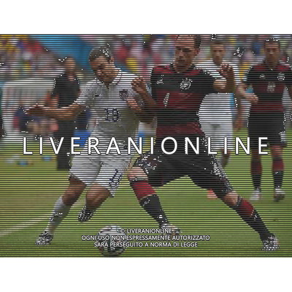 (140626) -- RECIFE, June 26, 2014 () -- Germany\'s Benedikt Howedes (R, front) vies with Graham Zusi of the U.S. during a Group G match between the U.S. and Germany of 2014 FIFA World Cup at the Arena Pernambuco Stadium in Recife, Brazil, on June 26, 2014.(/Guo Yong)(pcy) ©PHOTOHOT/Agenzia Aldo Liverani sas - ITALY ONLY - EDITORIAL USE ONLY