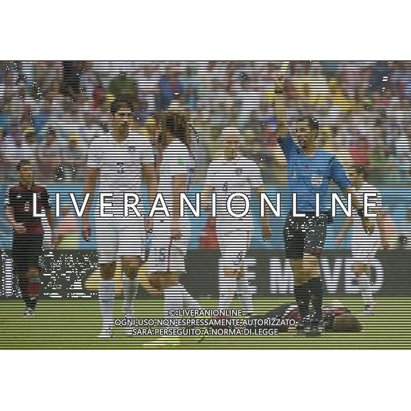(140626) -- RECIFE, June 26, 2014 () -- Uzbekistan\'s referee Ravshan Irmatov (1st R, front) shows a yellow card to Omar Gonzalez of the U.S. (1st L, front) during a Group G match between the U.S. and Germany of 2014 FIFA World Cup at the Arena Pernambuco Stadium in Recife, Brazil, on June 26, 2014.(/Lui Siu Wai)(pcy) ©PHOTOHOT/Agenzia Aldo Liverani sas - ITALY ONLY - EDITORIAL USE ONLY