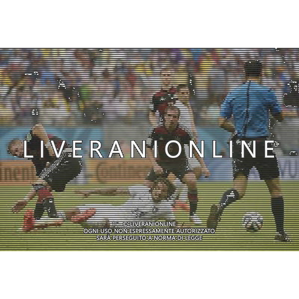 (140626) -- RECIFE, June 26, 2014 () -- Jermaine Jones of the U.S. (bottom) falls down in a competition during a Group G match between the U.S. and Germany of 2014 FIFA World Cup at the Arena Pernambuco Stadium in Recife, Brazil, on June 26, 2014.(/Lui Siu Wai)(pcy) ©PHOTOHOT/Agenzia Aldo Liverani sas - ITALY ONLY - EDITORIAL USE ONLY