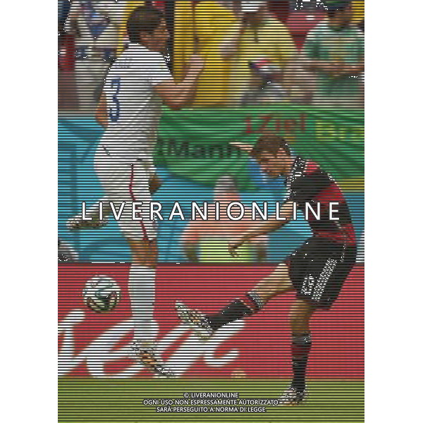 (140626) -- RECIFE, June 26, 2014 () -- Germany\'s Thomas Muller (R) passes the ball during a Group G match between the U.S. and Germany of 2014 FIFA World Cup at the Arena Pernambuco Stadium in Recife, Brazil, on June 26, 2014.(/Guo Yong)(pcy) ©PHOTOHOT/Agenzia Aldo Liverani sas - ITALY ONLY - EDITORIAL USE ONLY